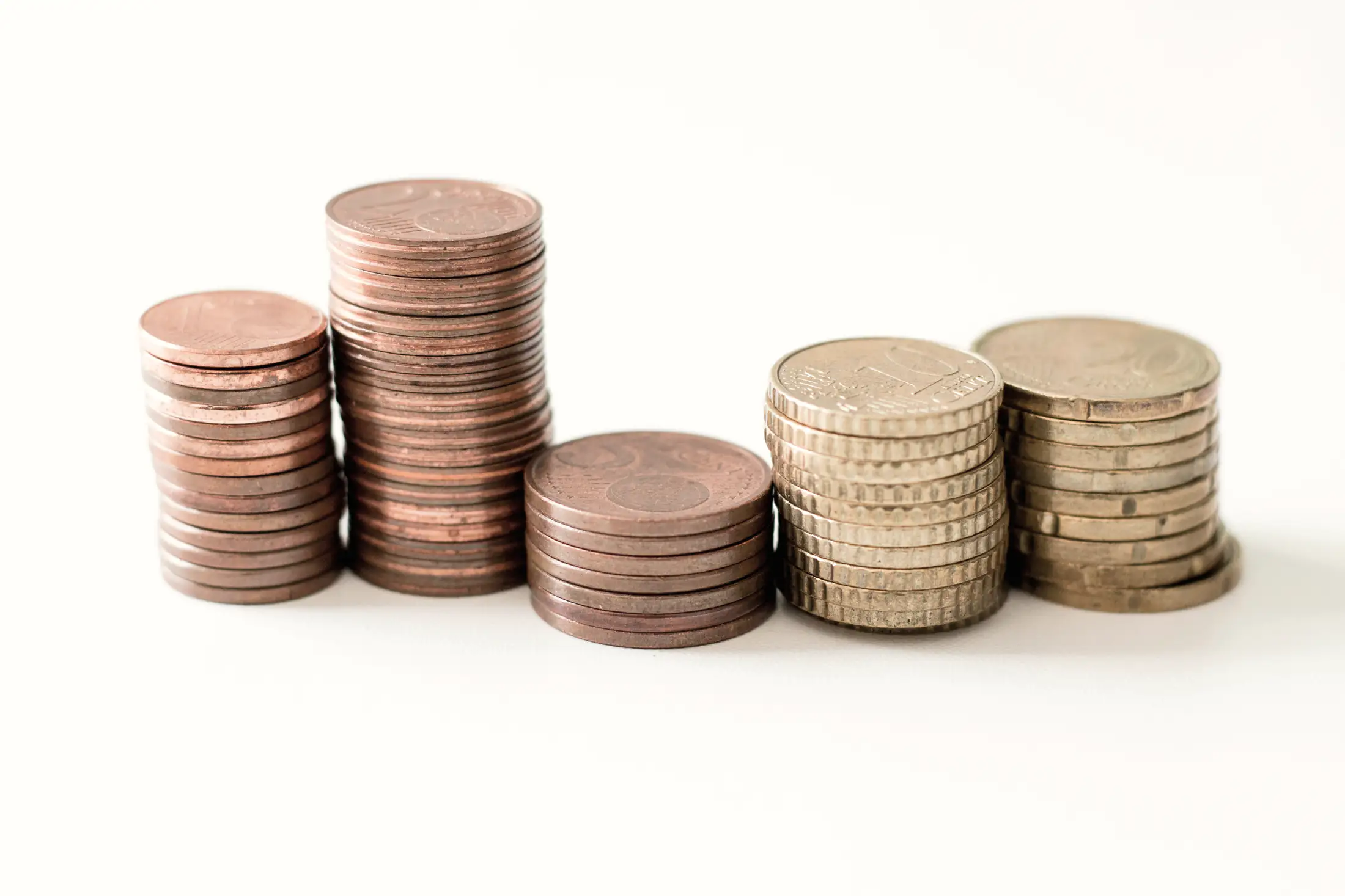 Coins stacked in piles of rising height