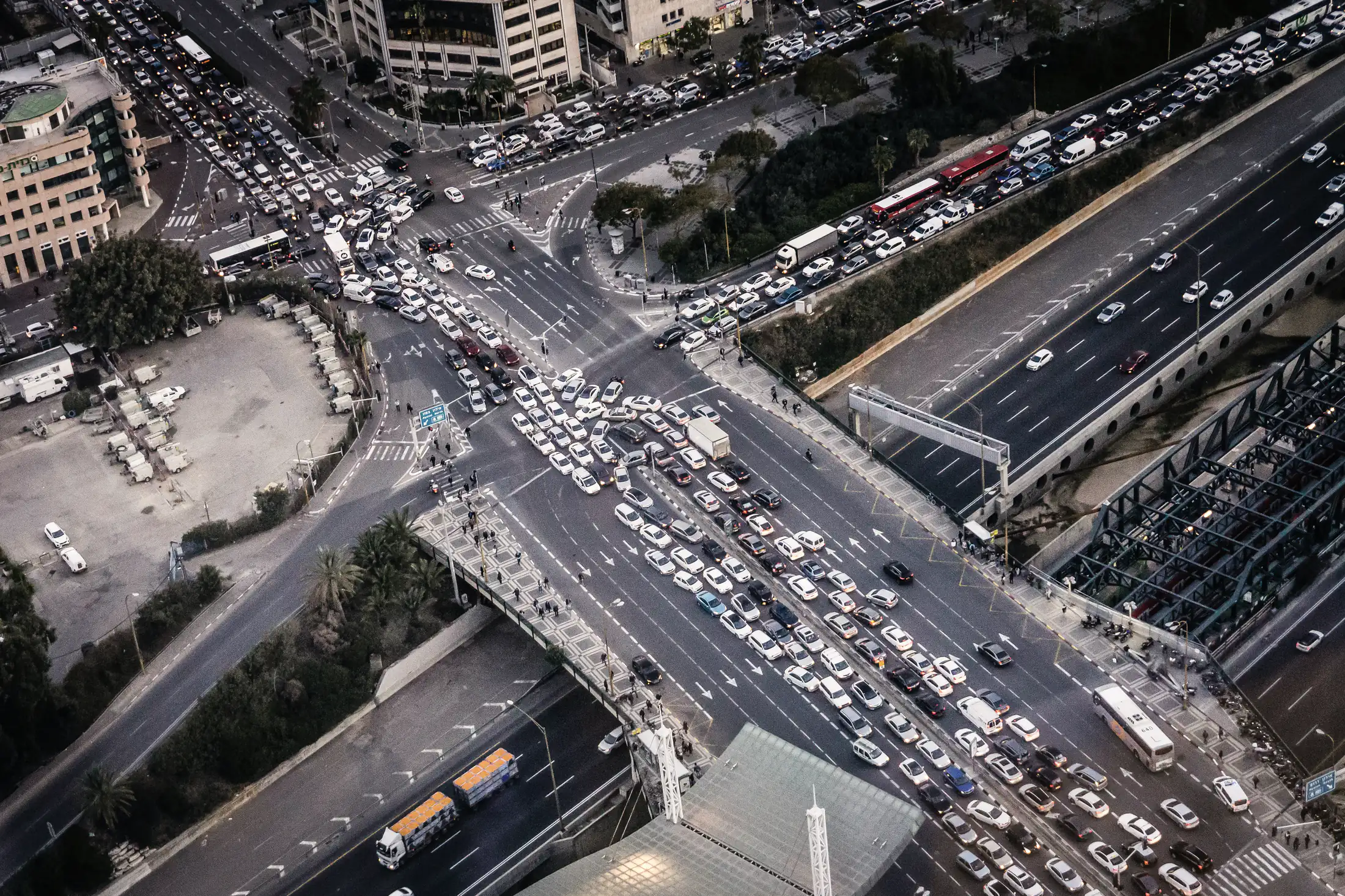 A gridlocked city crossroads seen from above